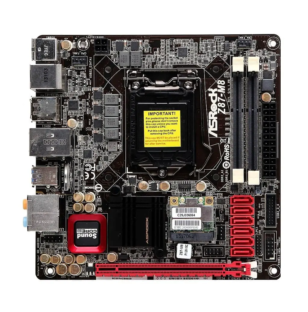ASRock Z87-M8 ITX socket 1150 moederbord - bovenaanzicht met gele waarschuwingssticker op CPU-socket