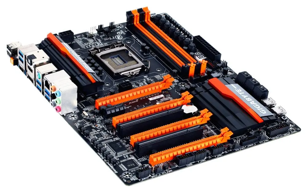 Gigabyte GA-Z87X-OC LGA1150 motherboard top view showing black PCB with orange and black heatsinks, CPU socket, RAM slots, PCIe slots, and I/O ports