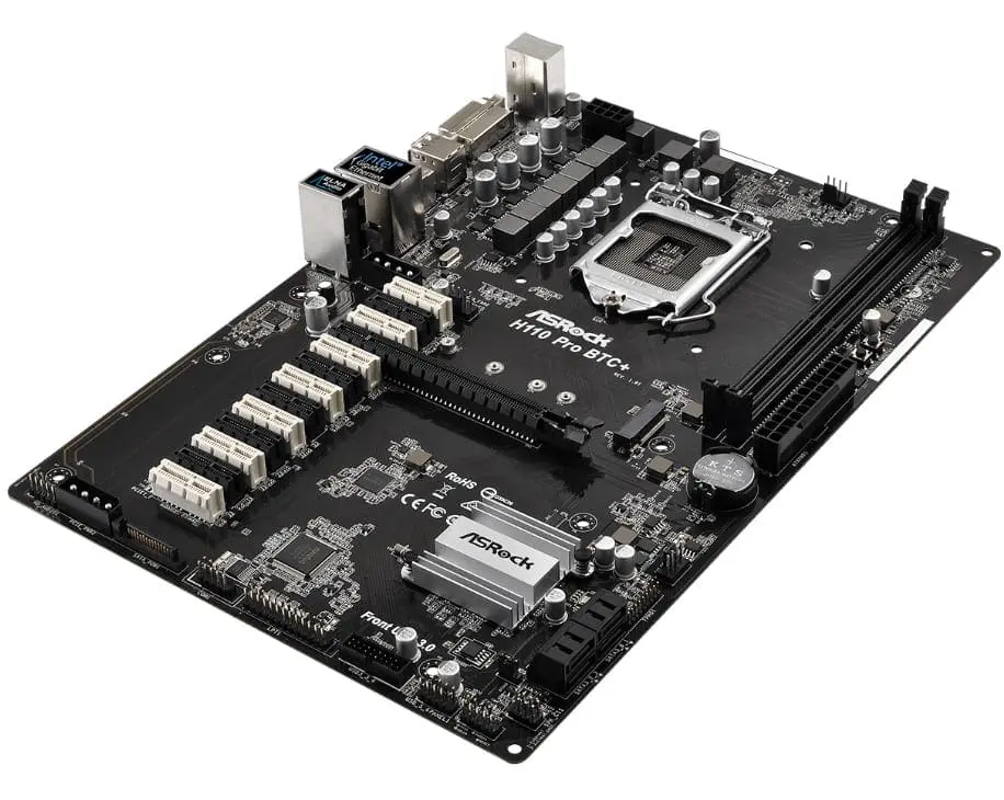 ASRock H110 Pro BTC+ LGA1151 motherboard top angled view showing CPU socket, RAM slots, power connectors, and multiple PCIe expansion slots