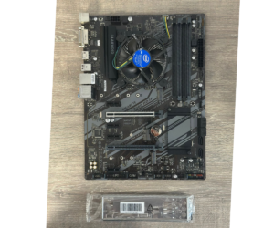 Gigabyte GA-B360 HD3P motherboard with Intel Core i5-9500 processor installed, shown from above with CPU cooler visible, accompanied by included accessory bracket below