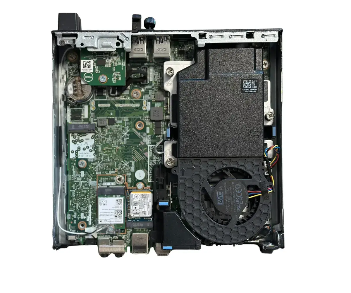 Dell Optiplex 7000 Mini PC internal components view showing motherboard, cooling fan, and storage modules